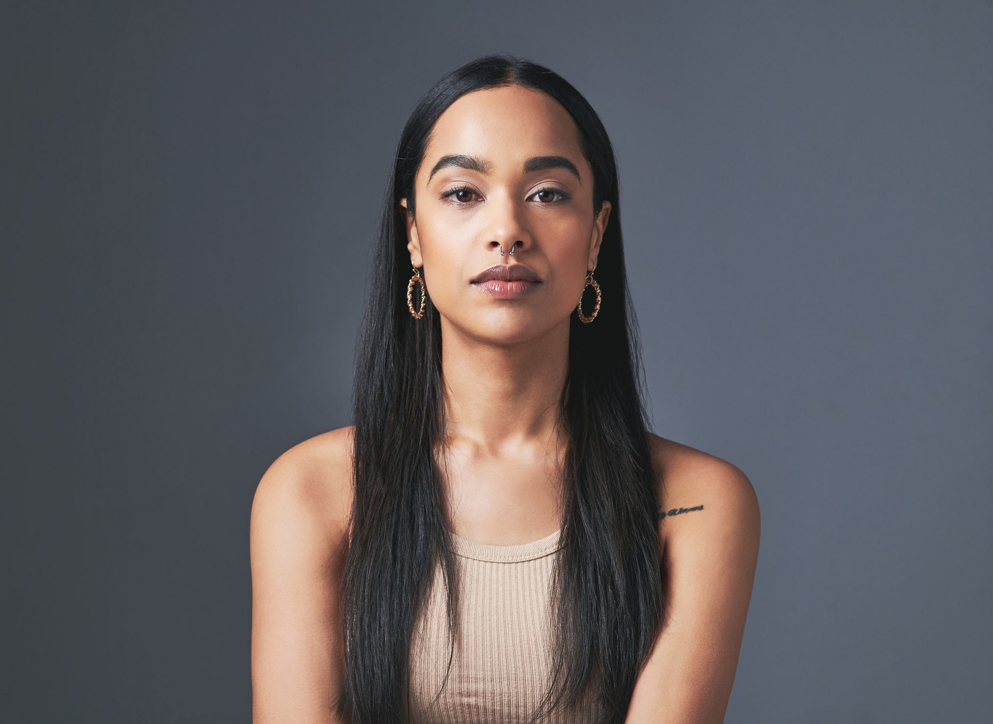 Portrait of a woman with long black hair.